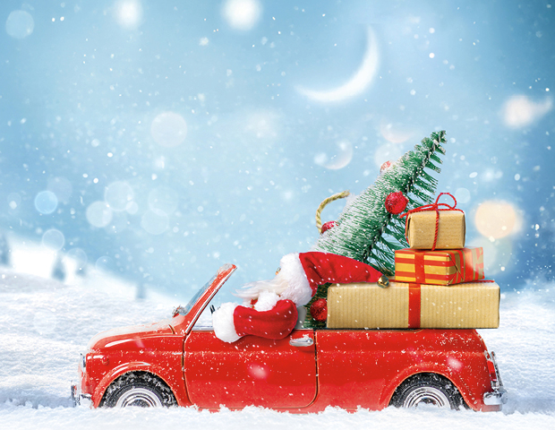 santa driving a truck full of gifts