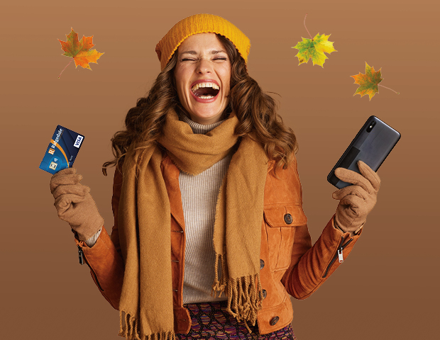 girl happy holding a phone and credit card